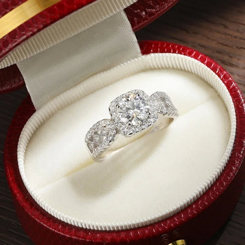 Bee-Bees 1ct D VVS1 Moissanite engagement ring in 18k white gold plated 925 silver with halo and side stones.