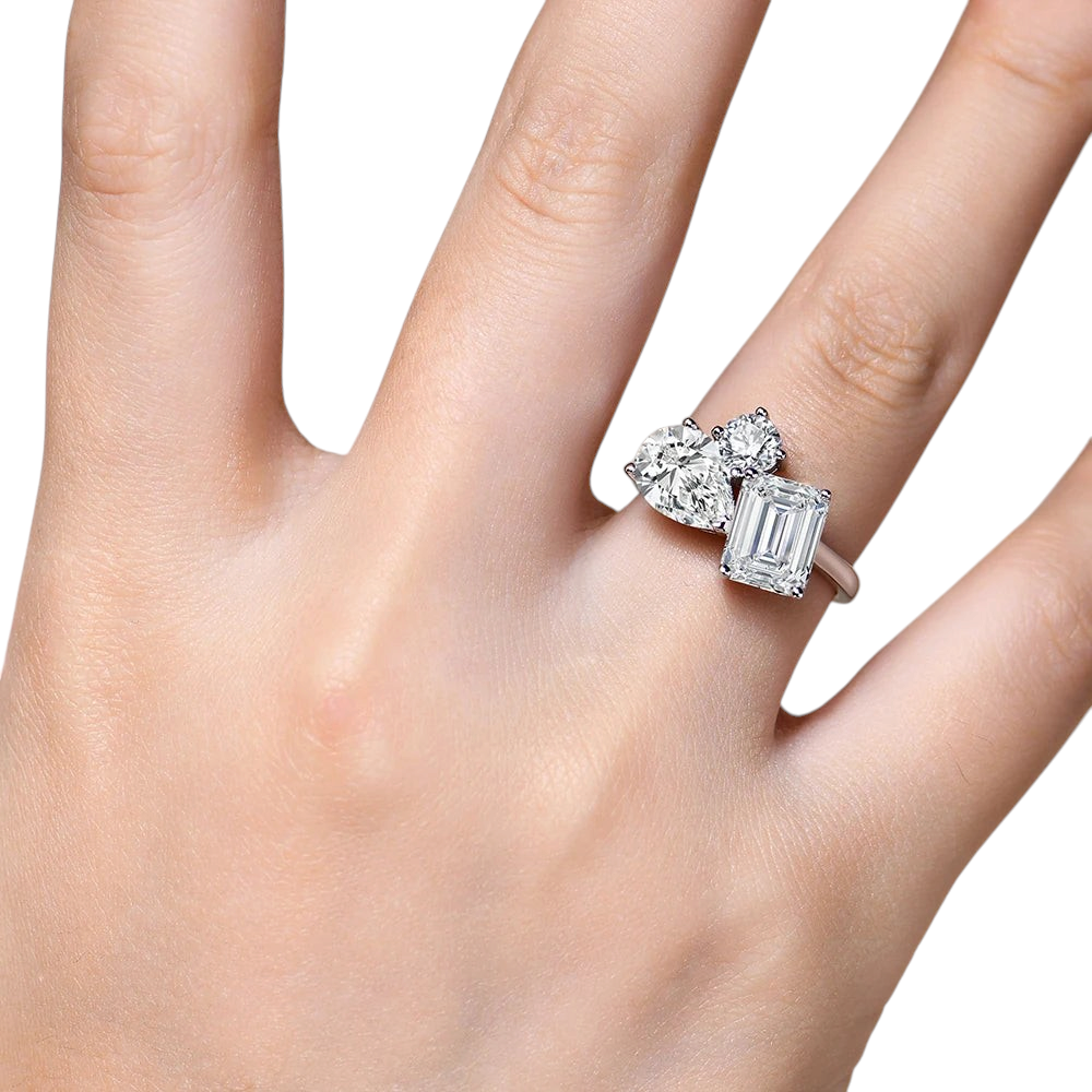 Bee-Bees 5.5CT moissanite engagement ring featuring pear and emerald cut stones on a 925 sterling silver band