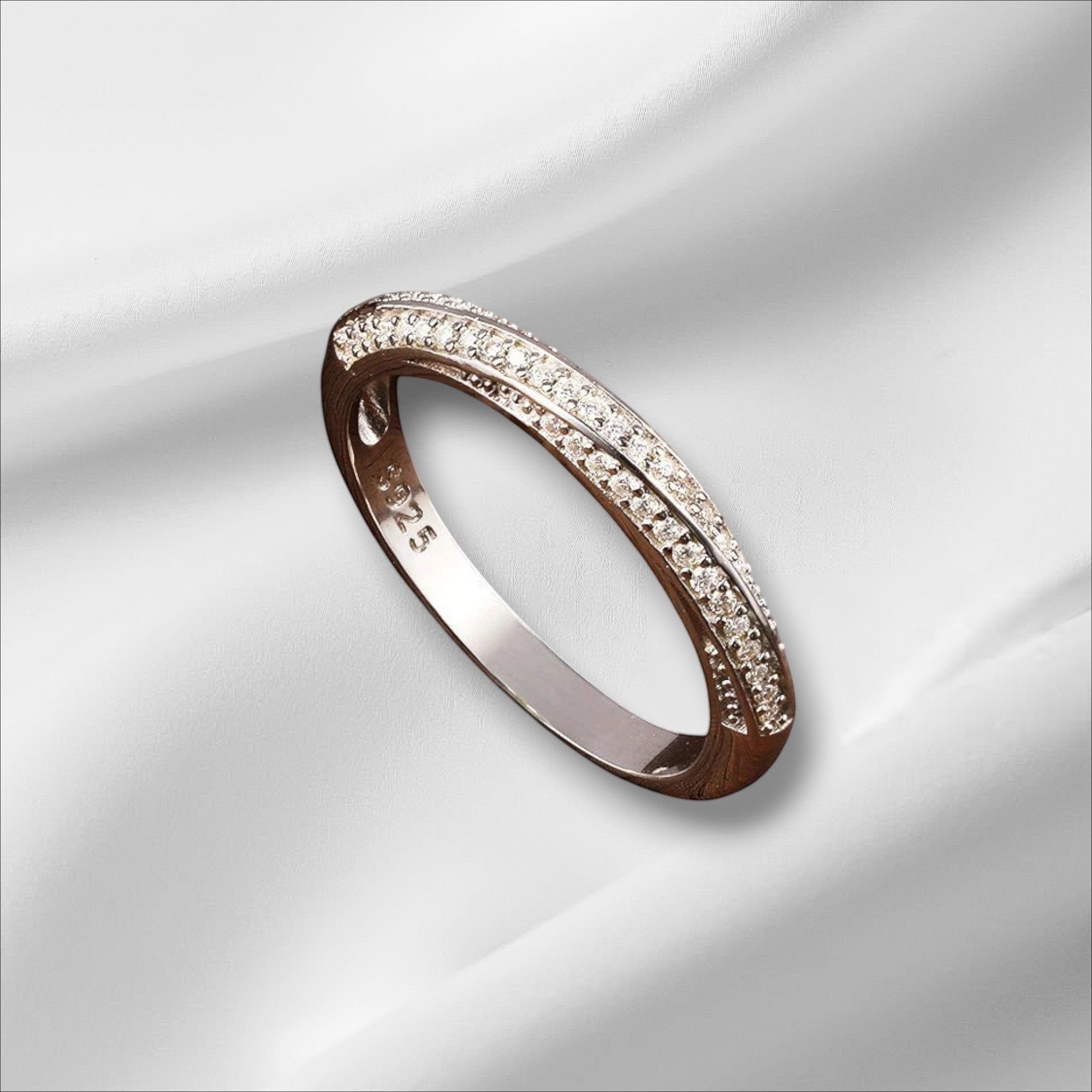 Bee-Bees 1mm Moissanite eternity band in 925 sterling silver with 18k white gold plating. Features two rows of tiny, sparkling stones.