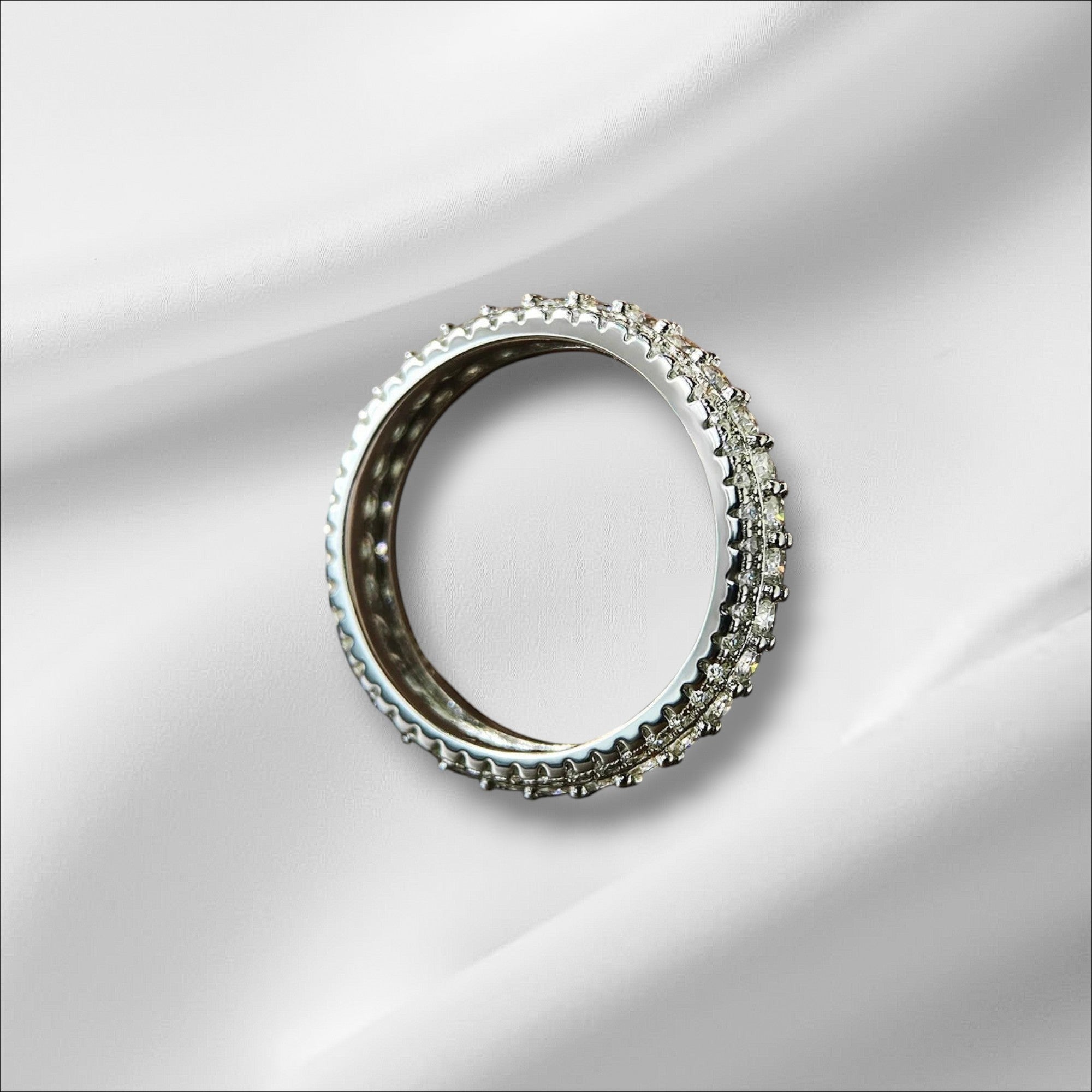 Bee-Bee's s925 Sterling Silver Moissanite Eternity Band Ring with 18k white gold plating and round-cut stones.