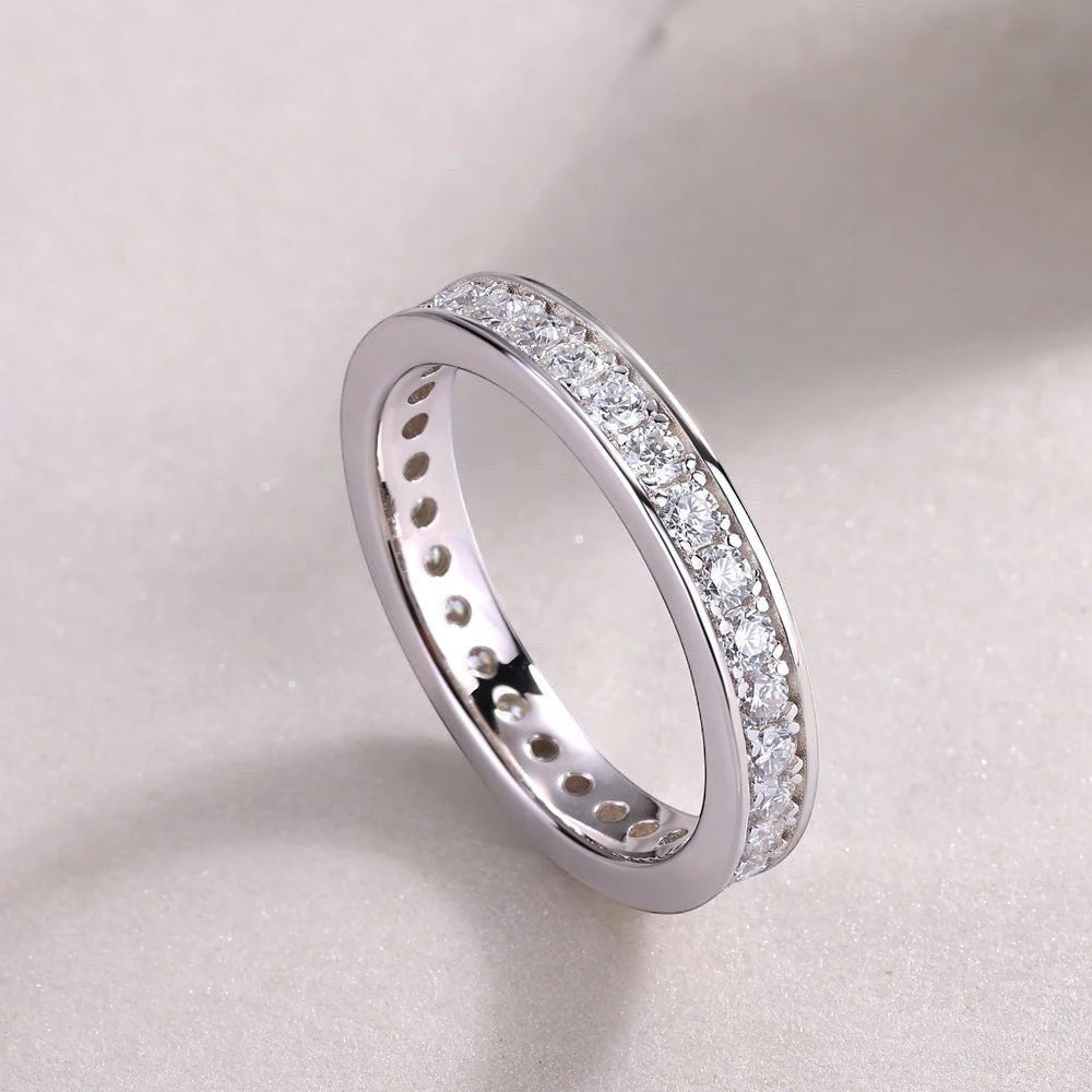 Bee-Bee's Classic 2mm Moissanite Eternity Band Ring in Sterling Silver with 18k Gold Plating. Features D VVS1 clarity stones.