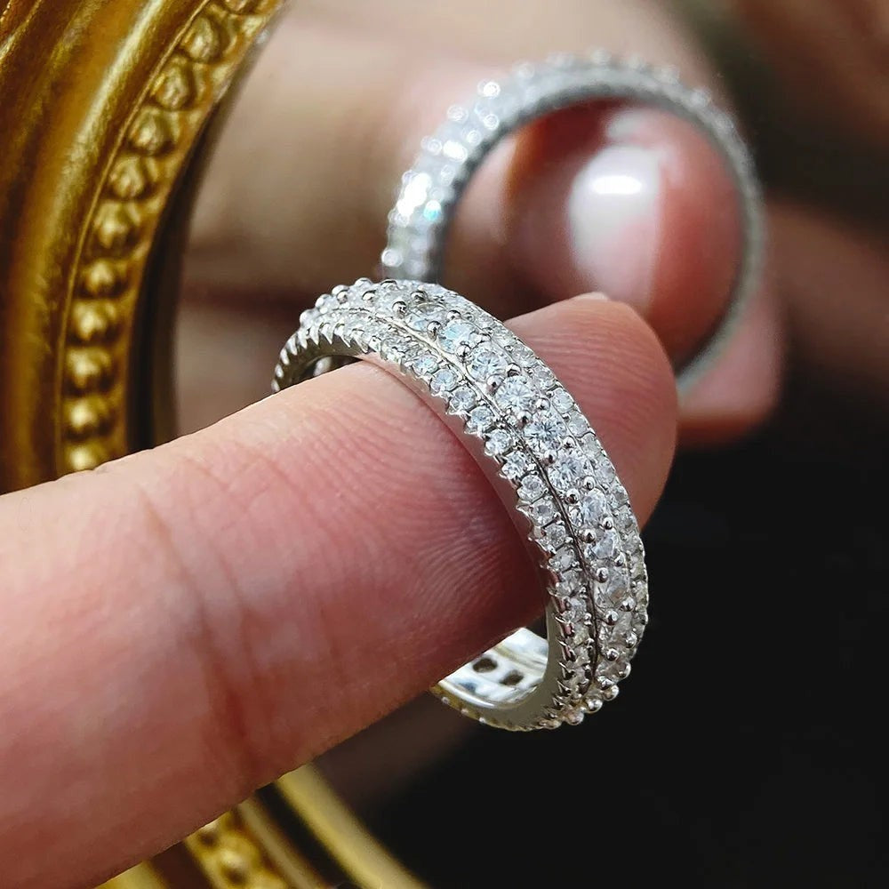 Bee-Bees Moissanite eternity band ring in s925 Sterling Silver with 18k white gold plating, featuring three rows of round-cut stones.