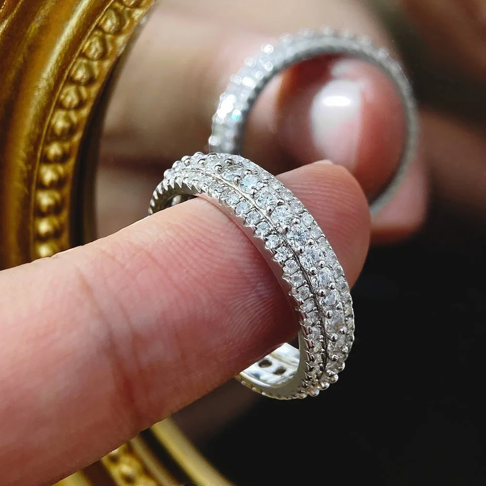 Bee-Bees Moissanite eternity band ring in s925 Sterling Silver with 18k white gold plating, featuring three rows of round-cut stones.
