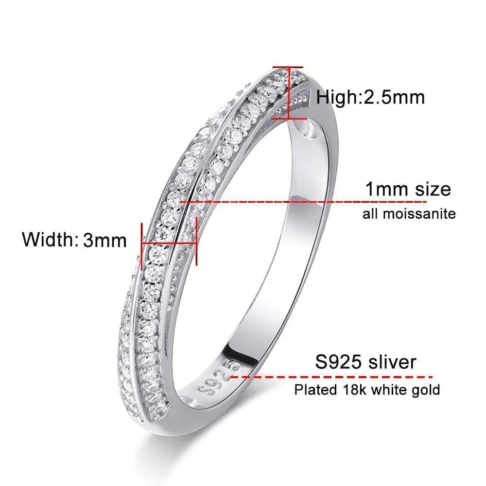 Bee-Bees 1mm Moissanite eternity band in 925 sterling silver with 18k white gold plating. Features tiny, round-cut stones.