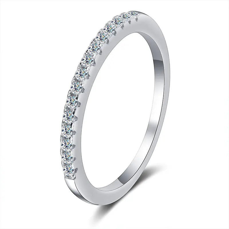 Bee-Bees 2mm D Color Moissanite eternity band in sterling silver with 18k white gold plating. Full circle of clear stones.
