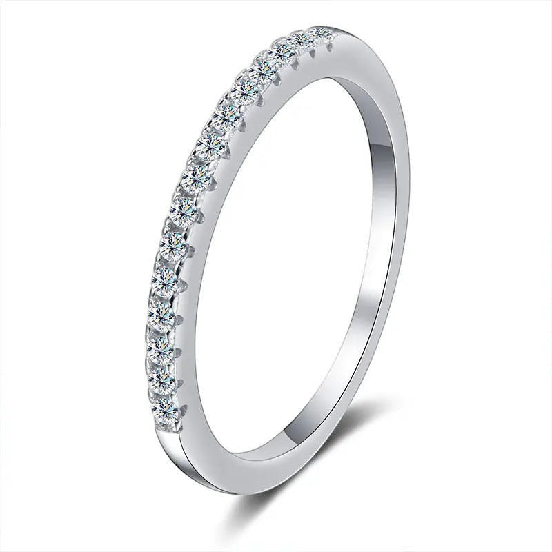 Bee-Bees 2mm D Color Moissanite eternity band in sterling silver with 18k white gold plating. Full circle of clear stones.