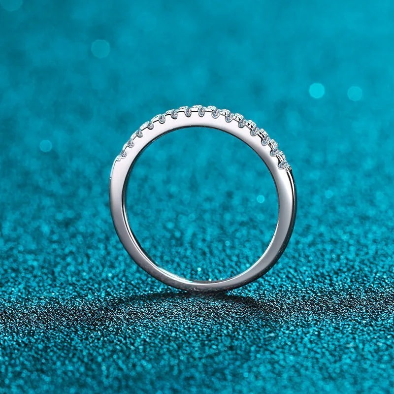 Bee-Bees 2mm D Color Moissanite eternity band in sterling silver with 18k white gold plating. Full circle of sparkling stones.