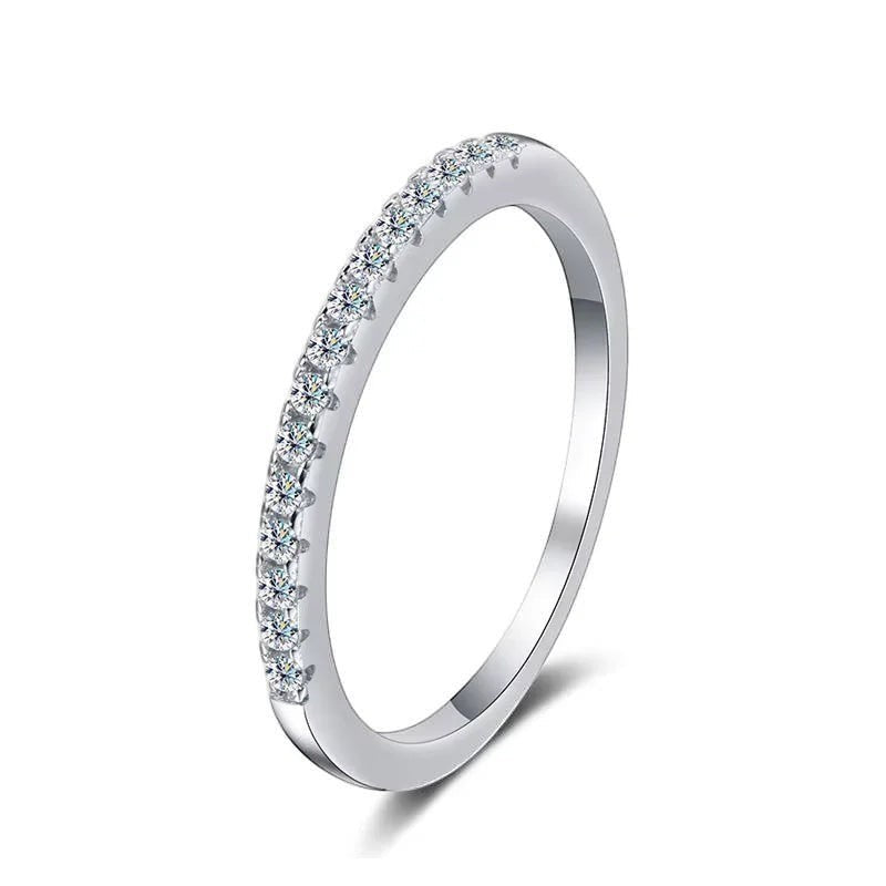 Bee-Bees 2mm D Color Moissanite eternity band in sterling silver with 18k white gold plating. Full circle of small, clear stones.