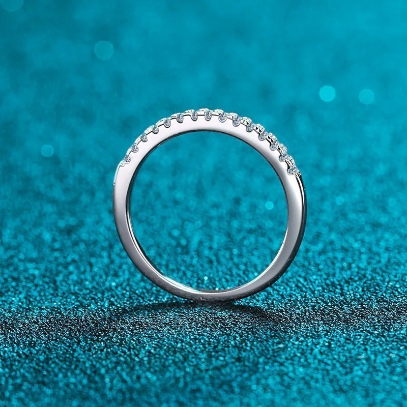 Bee-Bees 2mm D Color Moissanite eternity band in sterling silver with 18k white gold plating. Full circle of sparkling stones.