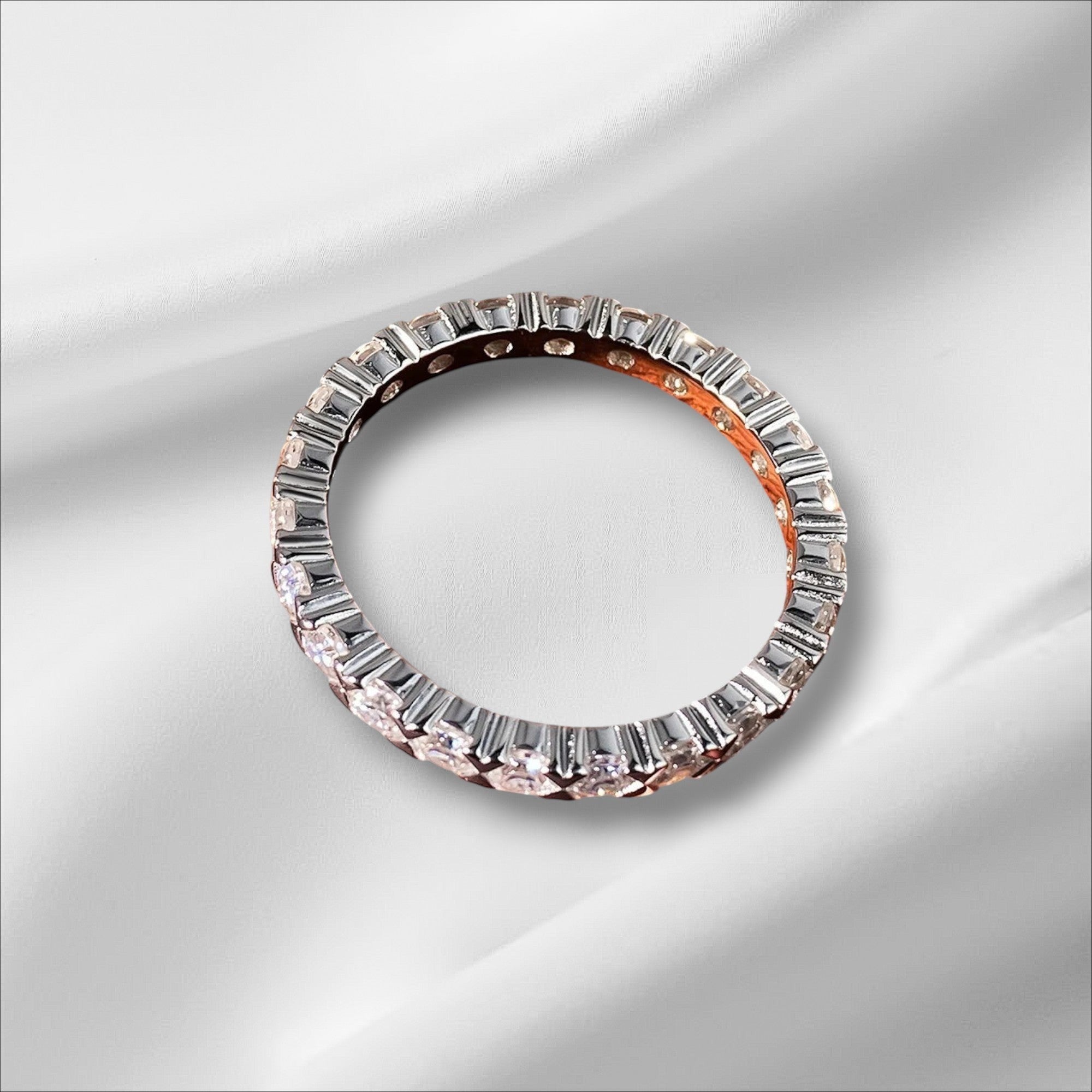 Bee-Bees 2.5mm Moissanite eternity band in s925 Sterling Silver with 18k gold plating. Features round-cut stones and GRA certification.