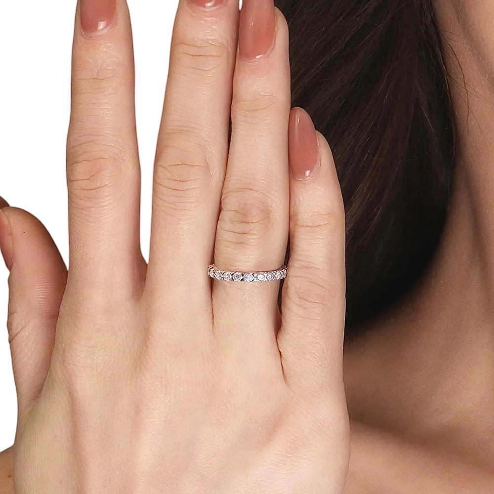 Bee-Bees 2.5mm Moissanite eternity band in s925 Sterling Silver with 18k gold plating. Dainty, full-circle ring with round-cut stones.