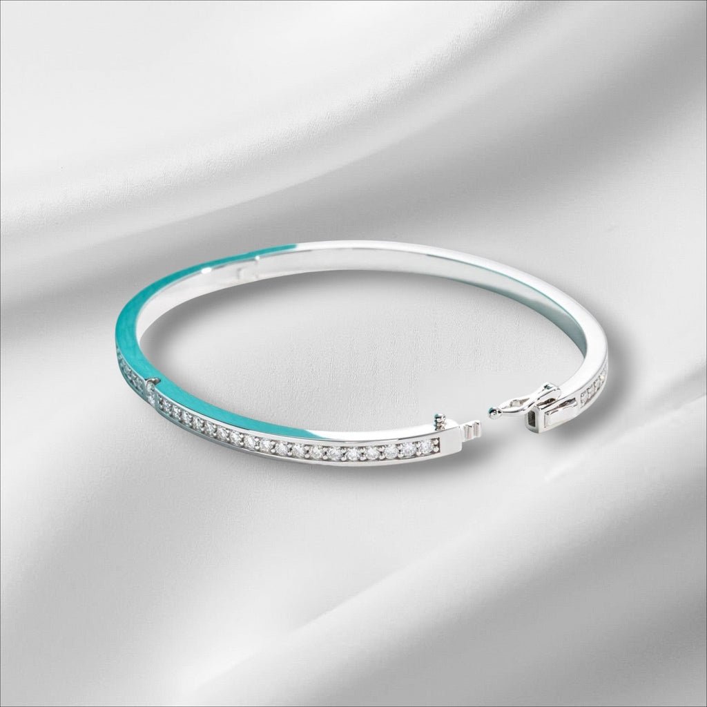 Bee-Bees 2ctw Moissanite eternity bangle in s925 sterling silver with 18k white gold plating. Features D VVS1 stones and a secure clasp.