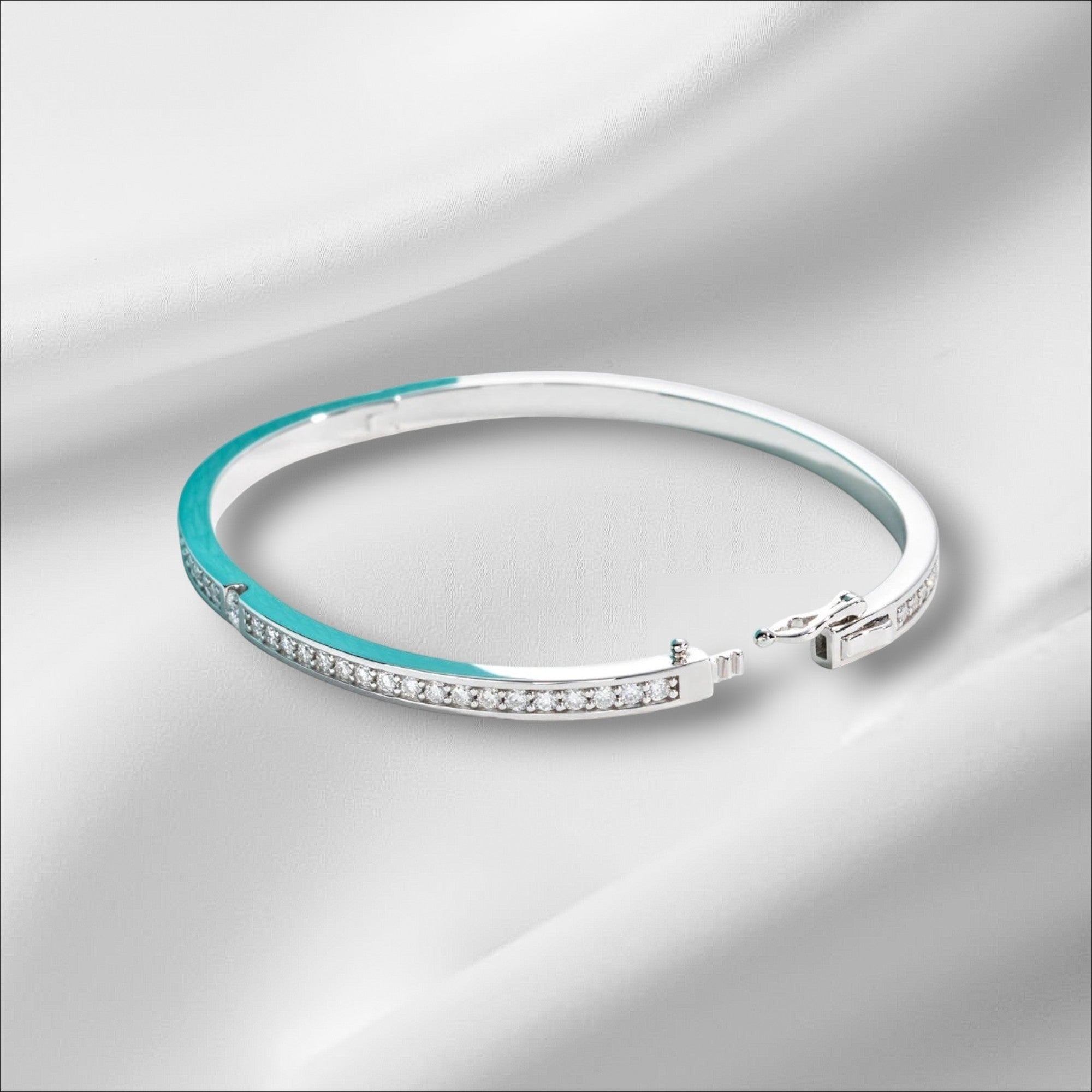 Bee-Bees 2ctw Moissanite eternity bangle in s925 sterling silver with 18k white gold plating. Features D VVS1 stones and a secure clasp.