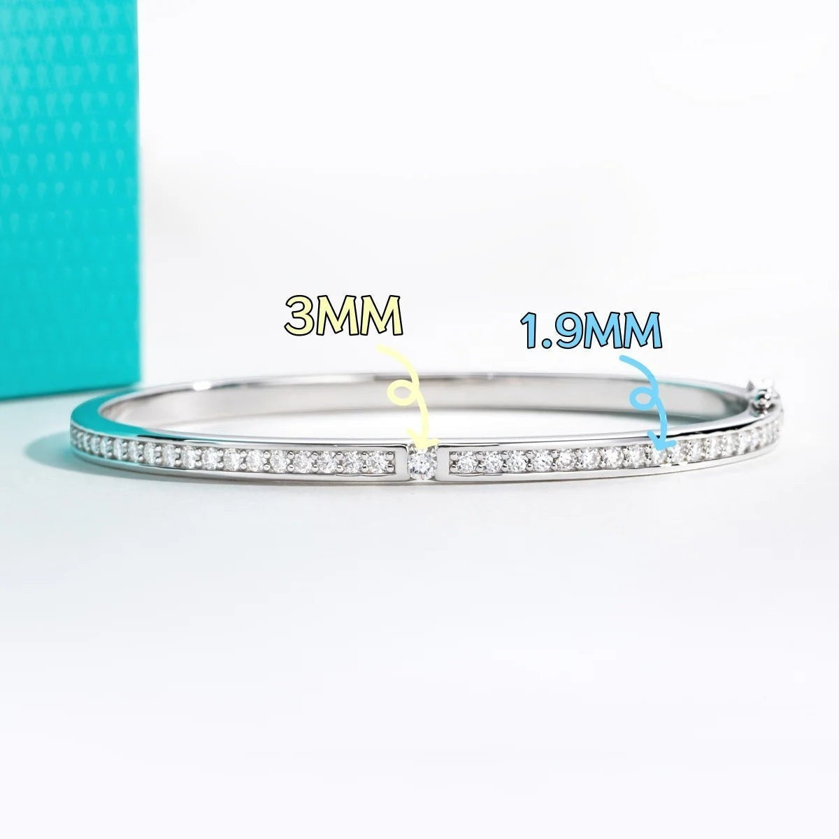 Bee-Bees 2ctw Moissanite eternity bangle in s925 sterling silver with 18k white gold plating. Features D VVS1 stones.