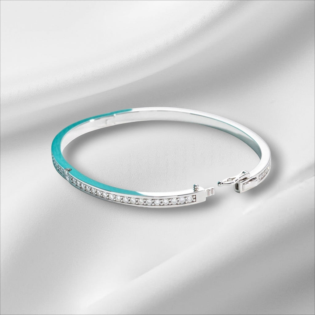 Bee-Bees 2ctw Moissanite eternity bangle in s925 sterling silver with 18k white gold plating. Features D VVS1 stones and a secure clasp.
