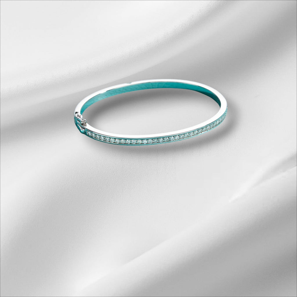 Bee-Bees 2ctw Moissanite eternity bangle in sterling silver with 18k white gold plating, D VVS1 stones, and GRA certification.