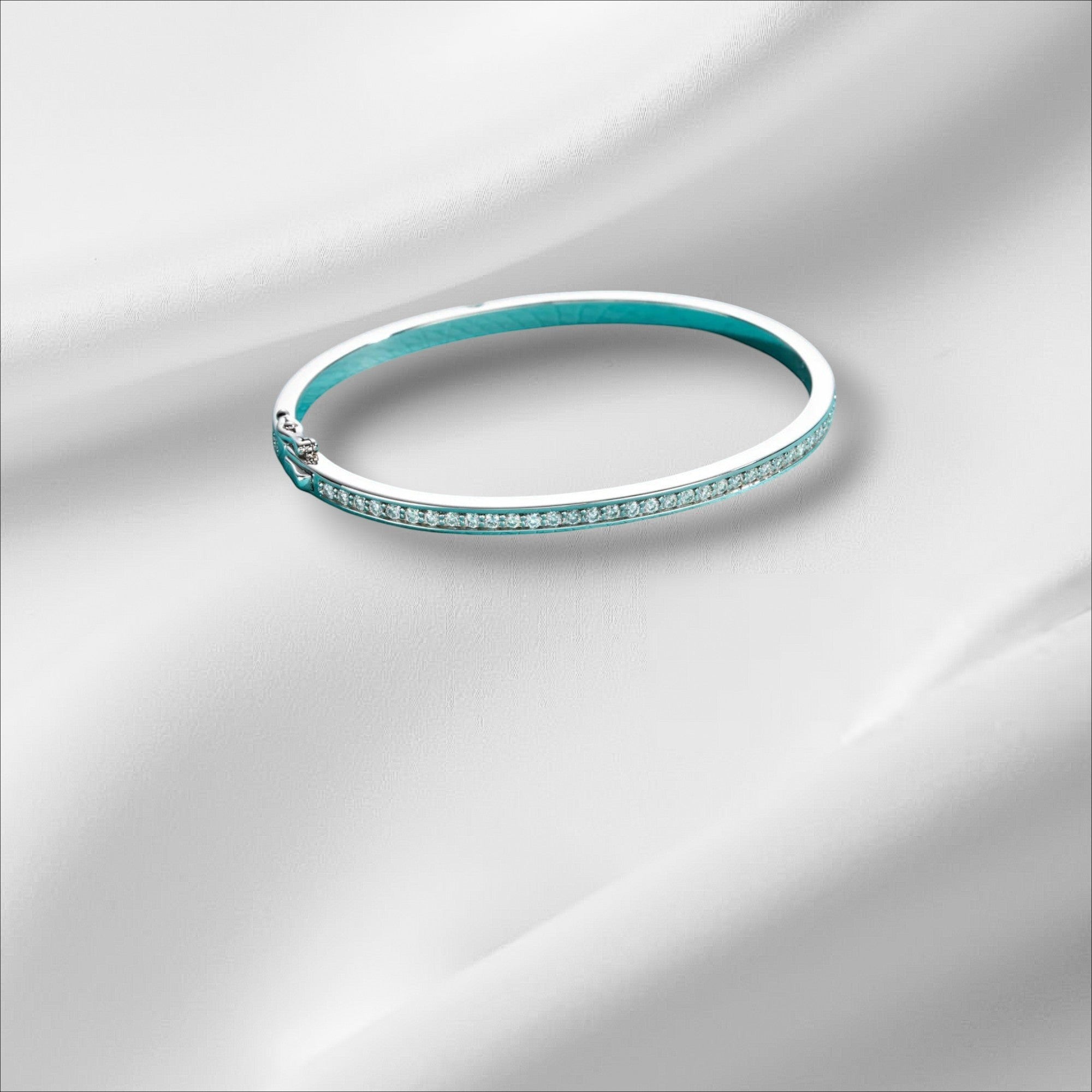 Bee-Bees 2ctw Moissanite eternity bangle in sterling silver with 18k white gold plating, D VVS1 stones, and GRA certification.