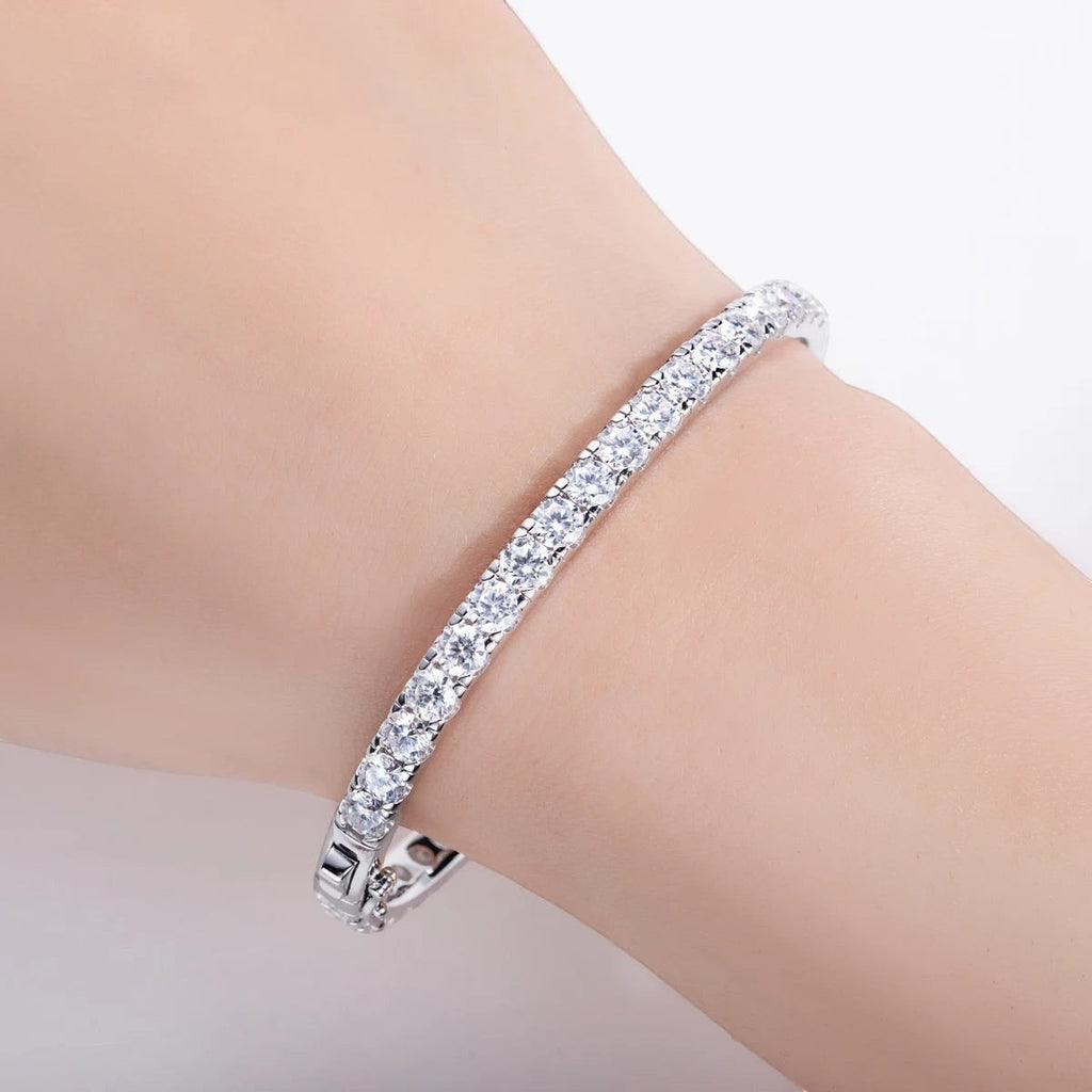Bee-Bee's 11.7ctw Moissanite eternity bangle in sterling silver with 18k white gold plating. Features 4mm round-cut stones and a secure clasp.