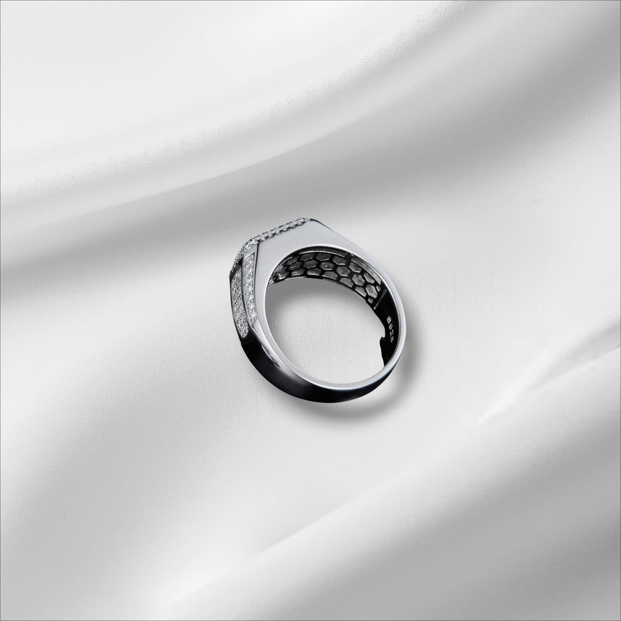 Bee-Bees D VVS Moissanite Eternity Ring in 925 Sterling Silver with 18k White Gold plating. Features small, brilliant stones and a honeycomb interior.