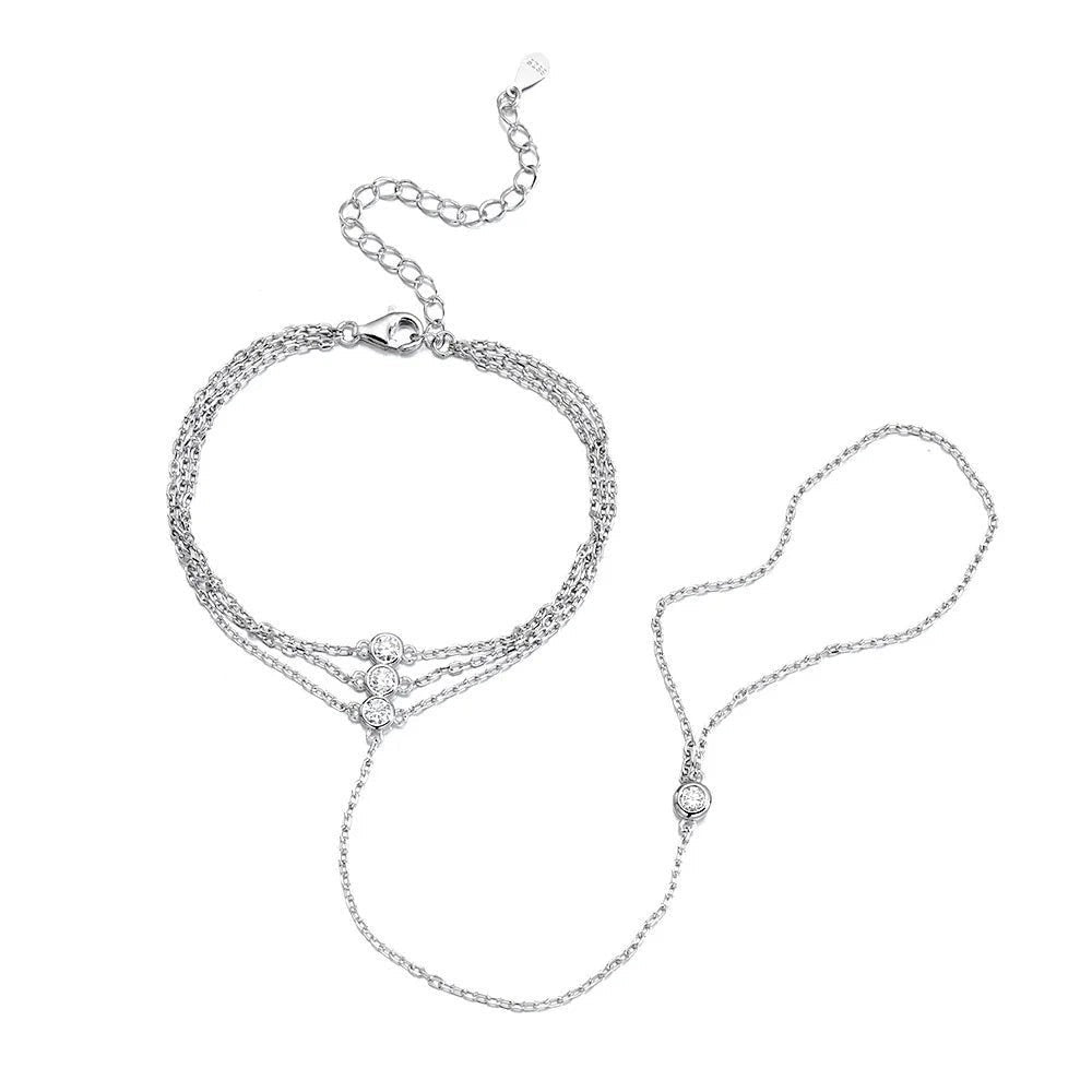 Bee-Bees 3mm moissanite finger bracelet in 925 sterling silver with adjustable chain and three clear stones.
