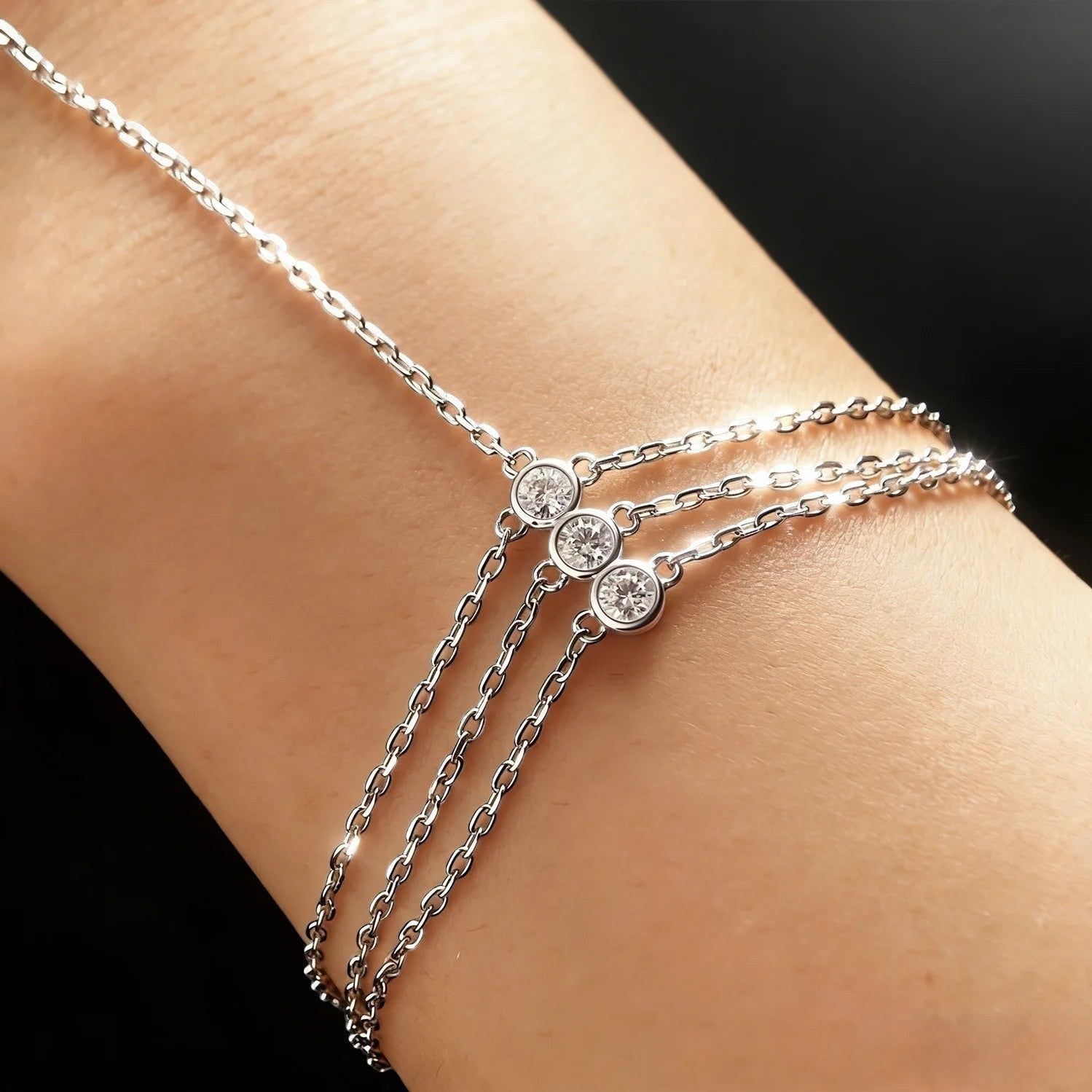 Bee-Bees 3mm moissanite adjustable finger bracelet in 925 sterling silver with three bezel-set stones.
