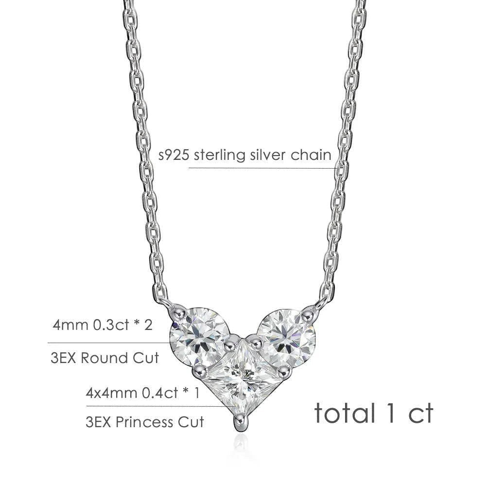 Bee-Bees sterling silver necklace with a heart-shaped pendant featuring three moissanite stones: two round brilliant cuts and one princess cut. Total 1ct.
