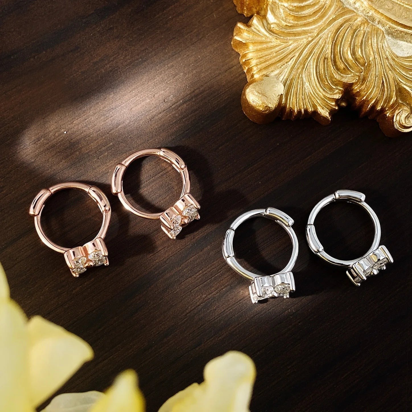 Bee-Bee's 3mm moissanite hoop earrings in rose gold and sterling silver, featuring D color VVS1 stones and a secure click-lock closure.