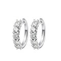 Bee-Bees white gold plated sterling silver hoop earrings with 3mm & 4mm D color moissanite stones.