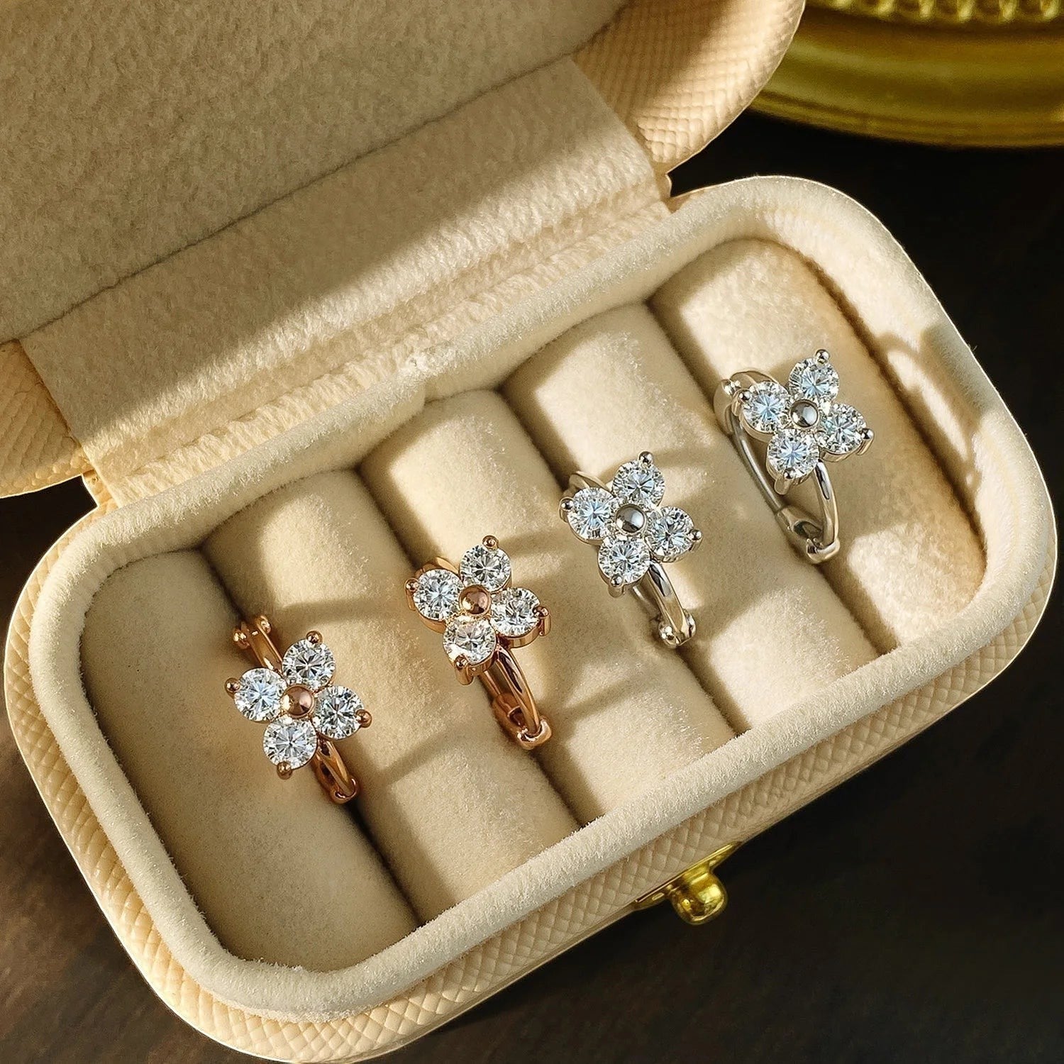 Bee-Bee's 3mm moissanite hoop earrings in rose gold and silver, featuring a flower design with clear VVS1 stones.