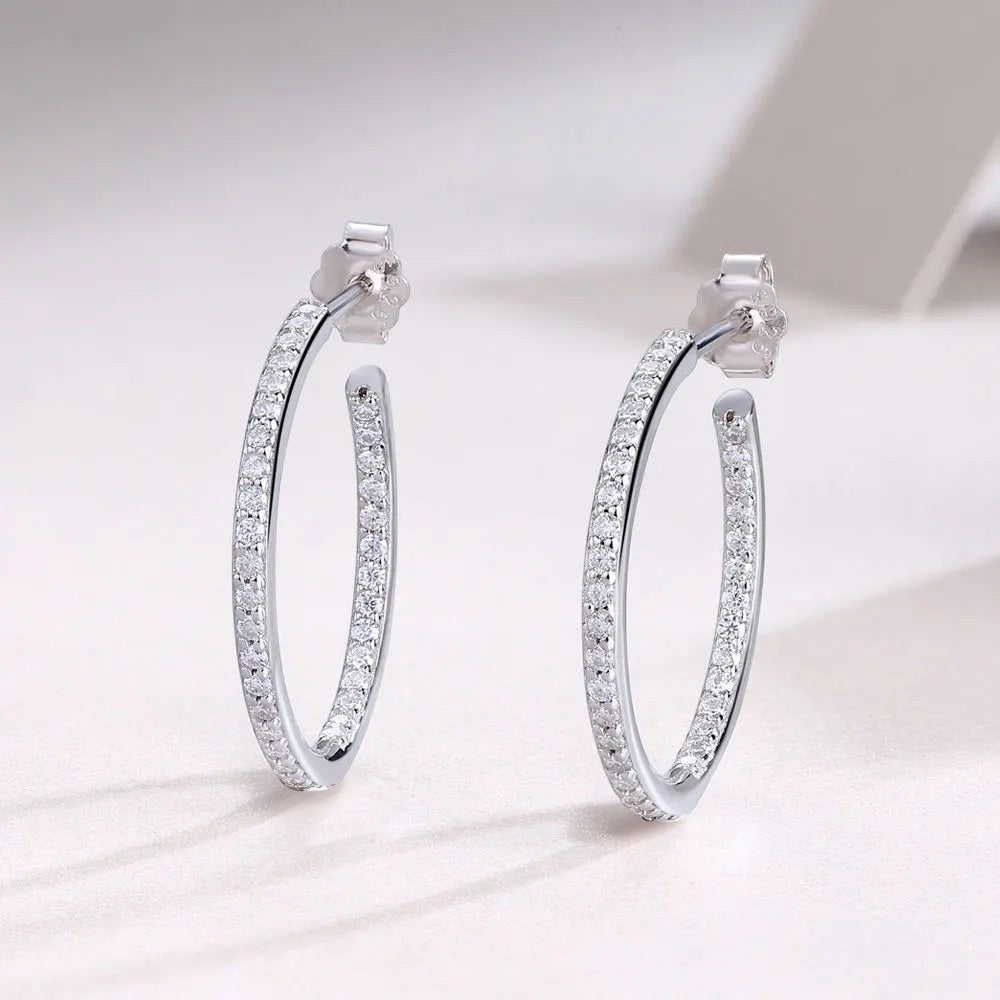 Bee-Bees dainty 1.5mm D color moissanite hoop earrings in S925 silver with white gold plating.