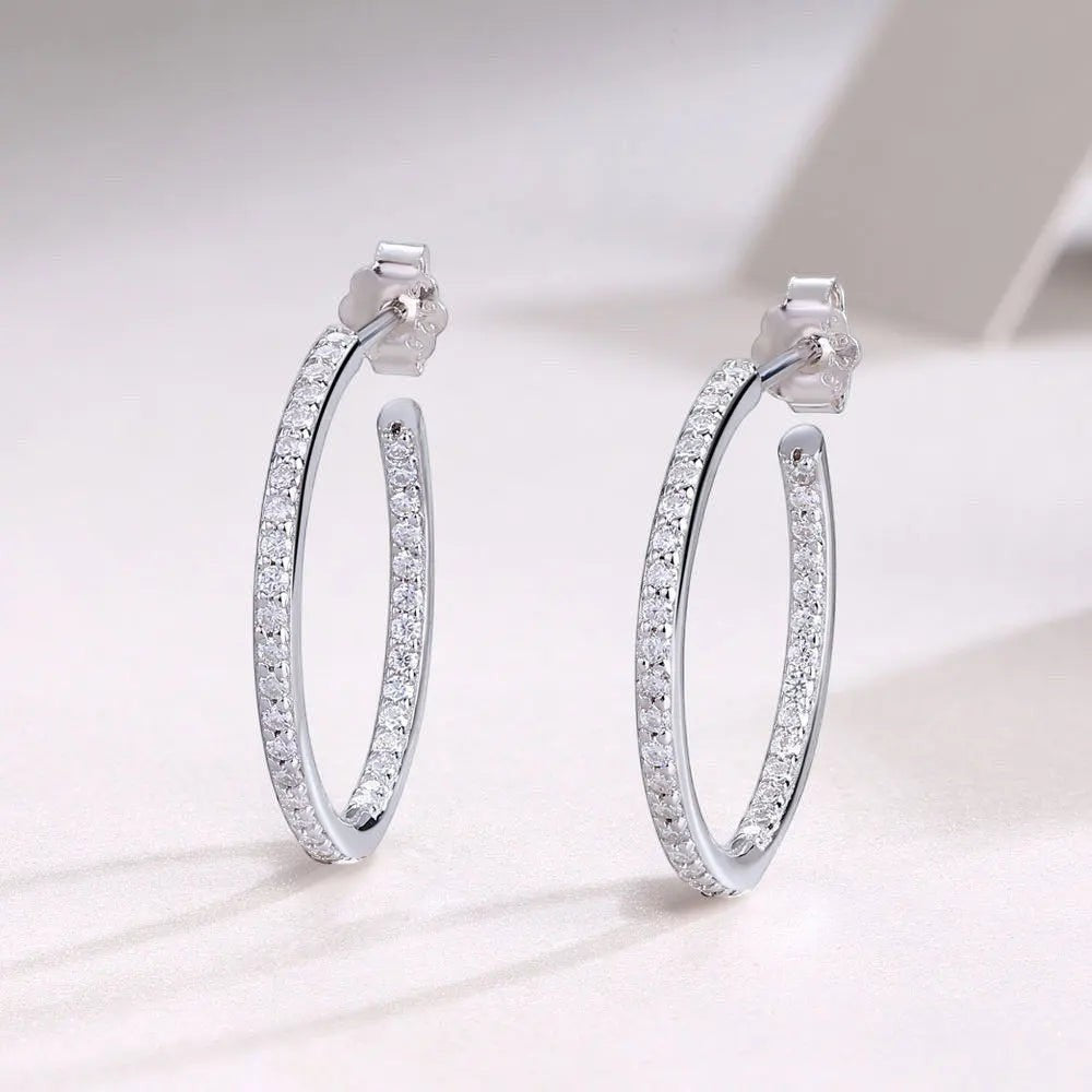 Bee-Bees dainty 1.5mm D color moissanite hoop earrings in S925 silver with white gold plating.