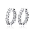 Bee-Bees 2.6ctw Moissanite eternity hoop earrings in 18k white gold plated silver with round brilliant cut stones.
