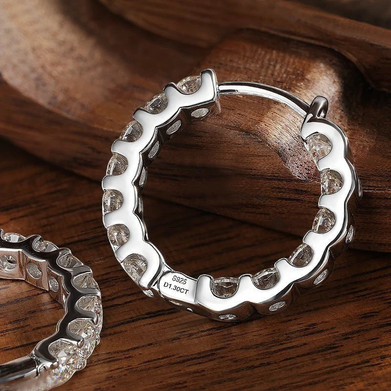 Bee-Bees 18k white gold plated silver hoop earrings with 2.6ctw D color moissanite stones.
