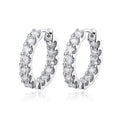 Bee-Bees 2.6ctw Moissanite eternity hoop earrings in 18k white gold plated silver with round brilliant cut stones.