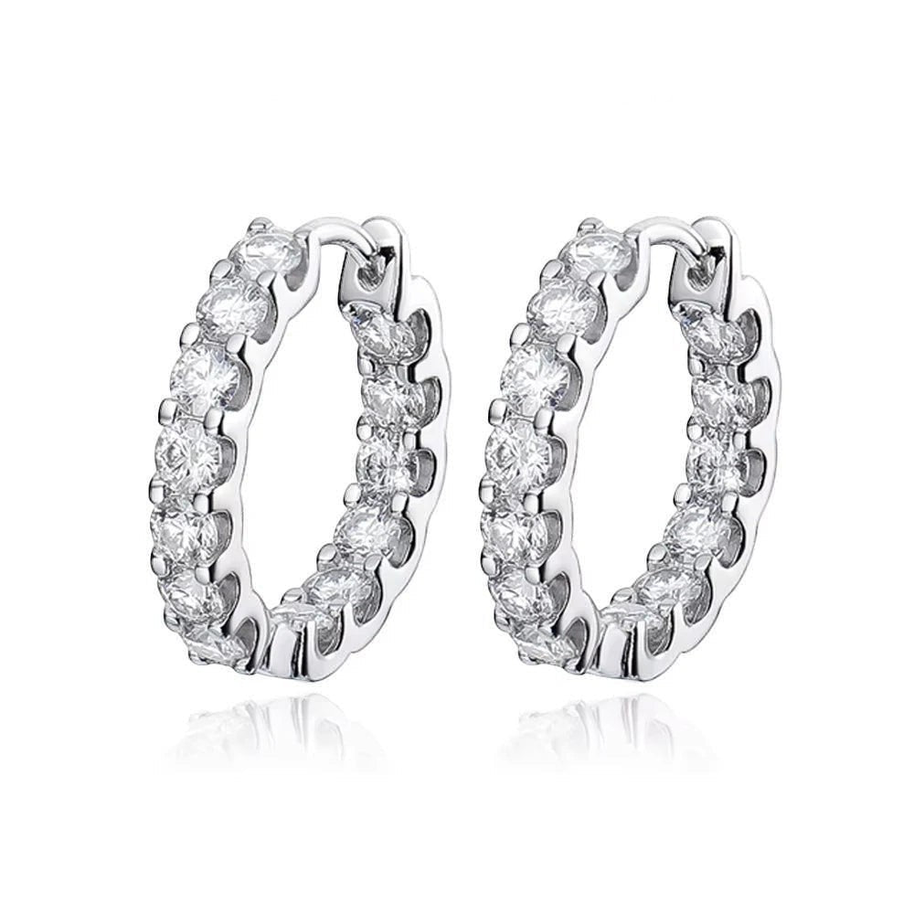 Bee-Bees 2.6ctw Moissanite eternity hoop earrings in 18k white gold plated silver with round brilliant cut stones.