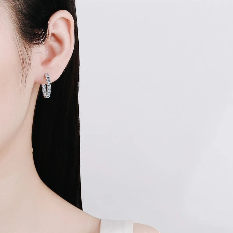 Bee-Bees 2.6ctw D Color Moissanite eternity hoop earrings in 18k white gold plated sterling silver.