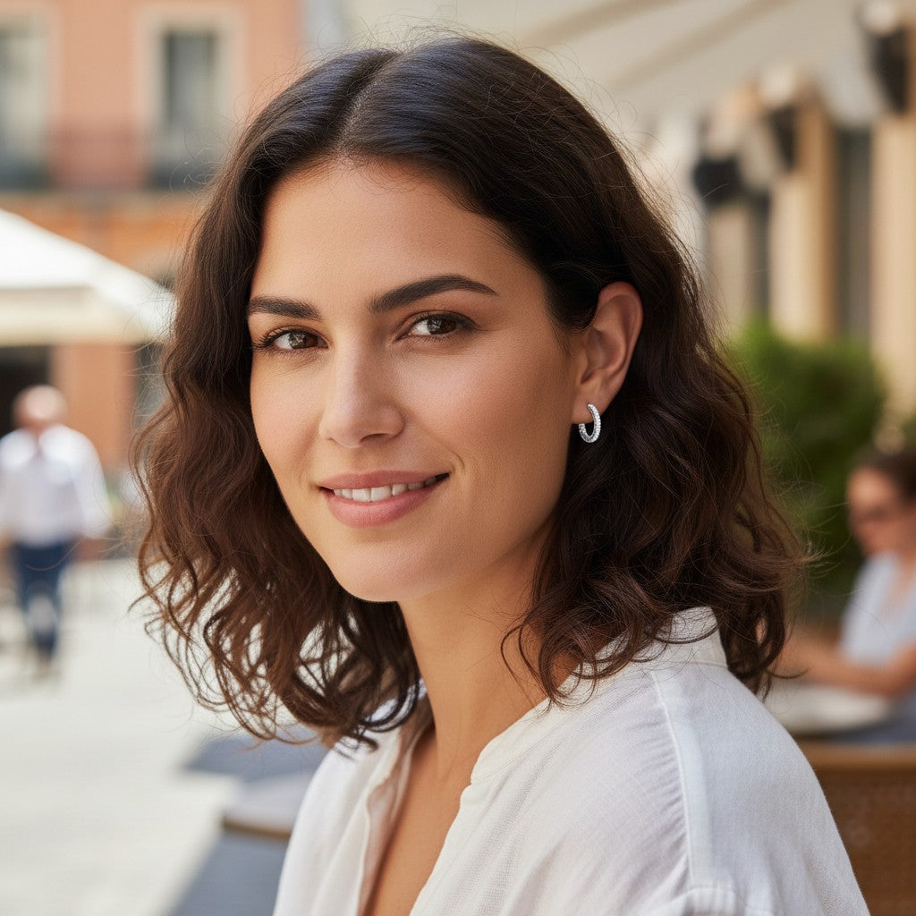 Bee-Bees 1.5mm D color moissanite hoop earrings in S925 sterling silver worn by a woman in a casual outdoor setting.