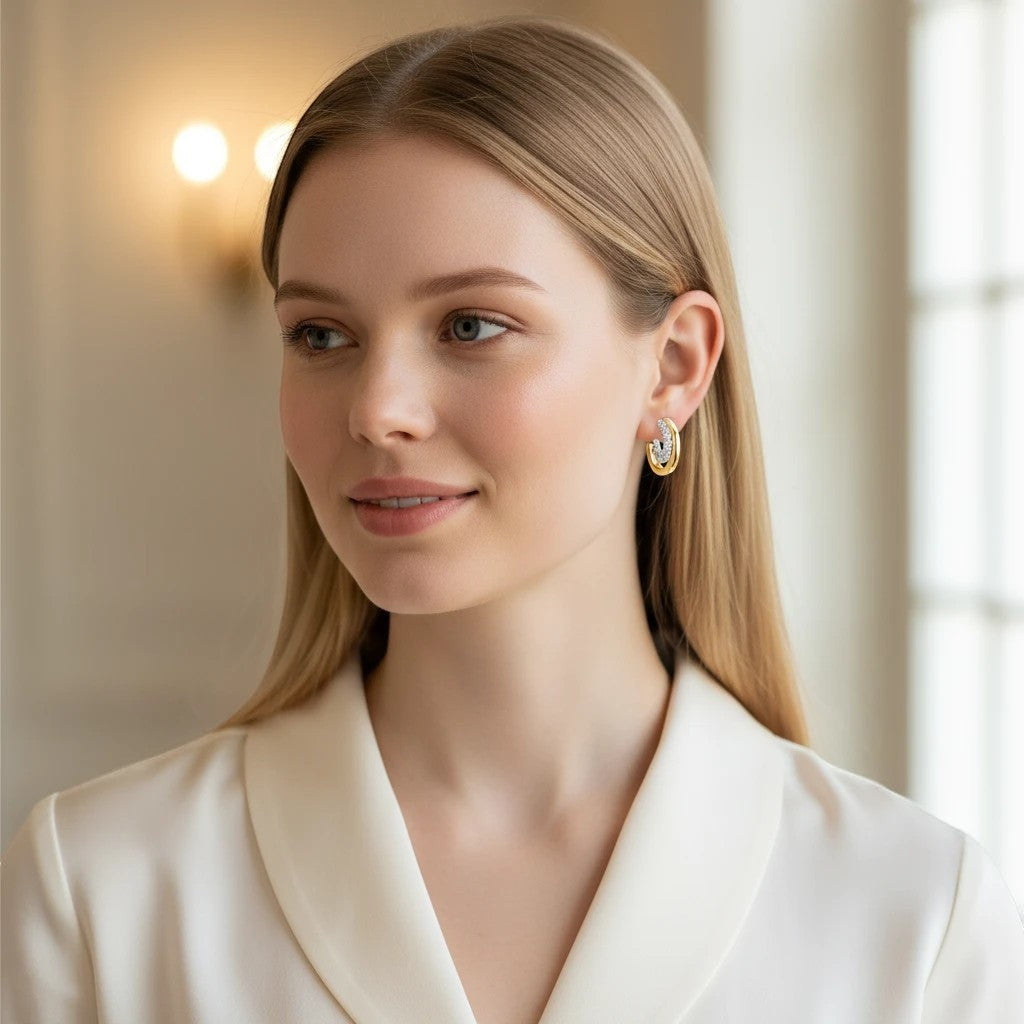 Bee-Bees D Color VVS1 Moissanite huggie hoop earrings in 18K gold plated sterling silver, pave-set with 24 stones.