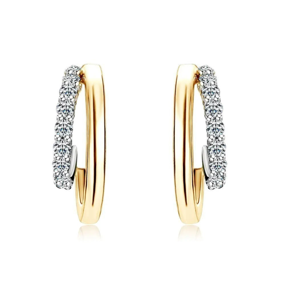 Bee-Bees yellow gold plated sterling silver huggie hoop earrings with pave-set D Color VVS1 moissanite stones.