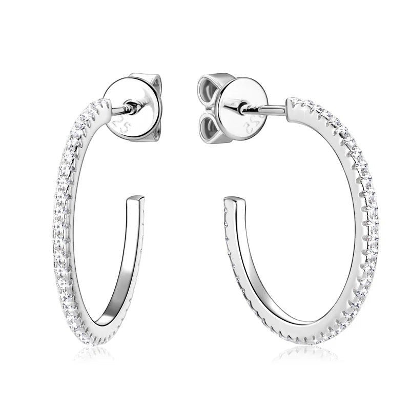 Bee-Bee's sterling silver huggie hoop earrings with pave-set D Color VVS1 moissanite stones.