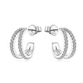 Bee-Bee's sterling silver huggie hoop earrings with pave-set D Color VVS1 moissanite stones.