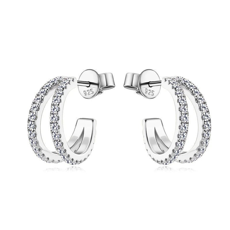 Bee-Bee's sterling silver huggie hoop earrings with pave-set D Color VVS1 moissanite stones.