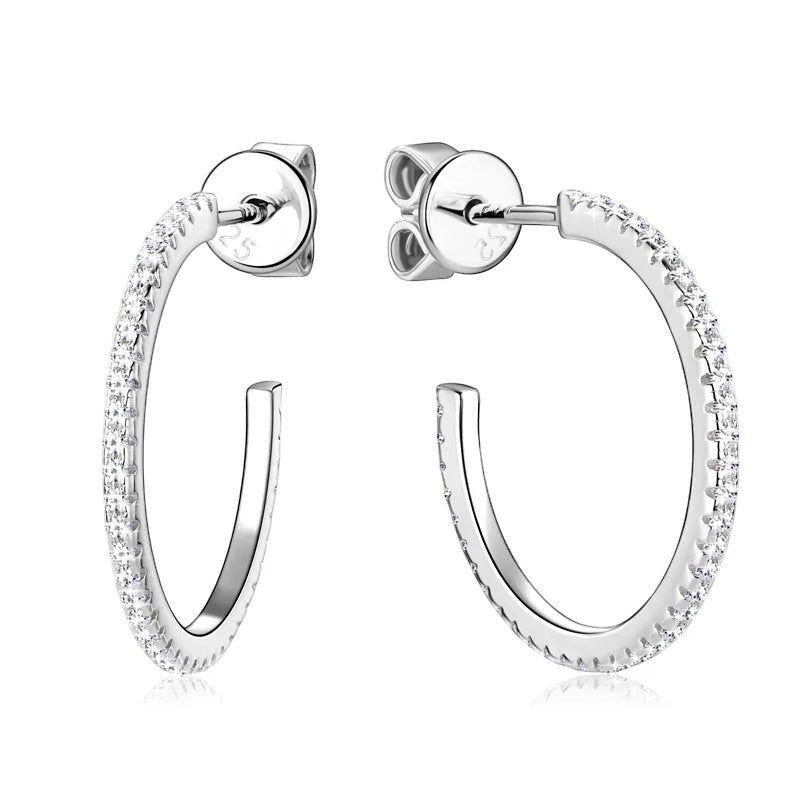 Bee-Bee's sterling silver huggie hoop earrings with pave-set D Color VVS1 moissanite stones.