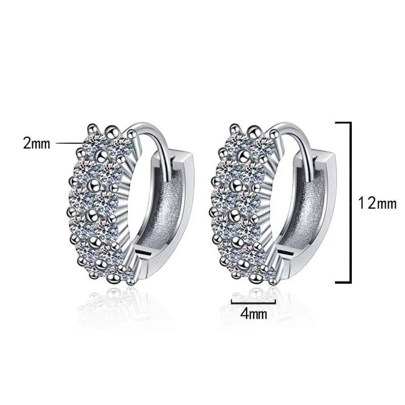 Bee-Bees D Color VVS1 Moissanite huggie hoop earrings in 925 Sterling Silver with 18K white gold plating. Features multiple rows of sparkling round brilliant cut stones.