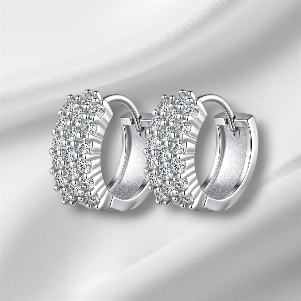 Bee-Bees D Color VVS1 Moissanite Huggie Hoop Earrings in 925 Sterling Silver with 18K White Gold plating.