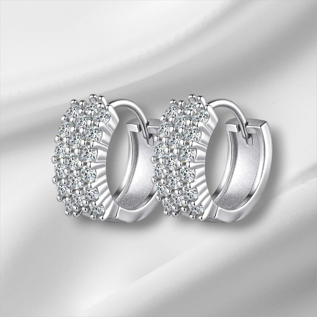 Bee-Bees D Color VVS1 Moissanite Huggie Hoop Earrings in 925 Sterling Silver with 18K White Gold plating.