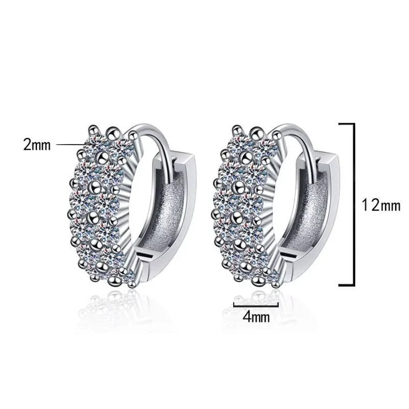 Bee-Bees D Color VVS1 Moissanite huggie hoop earrings in 925 Sterling Silver with 18K white gold plating. Features multiple rows of sparkling round brilliant cut stones.