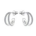 Bee-Bee's sterling silver huggie hoop earrings with pave-set D Color VVS1 moissanite stones.