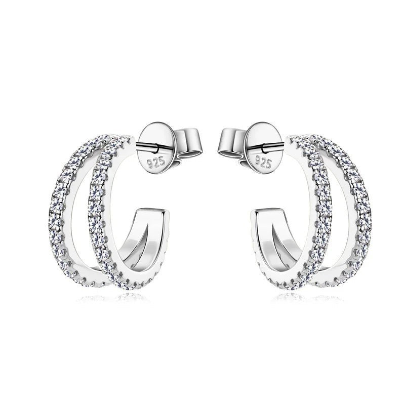 Bee-Bee's sterling silver huggie hoop earrings with pave-set D Color VVS1 moissanite stones.