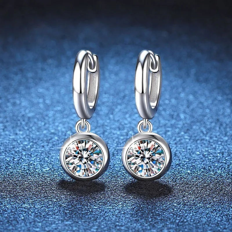 Bee-Bee's Sterling silver hoop earrings with D Color VVS1 moissanite drop pendant. Round brilliant cut stone.